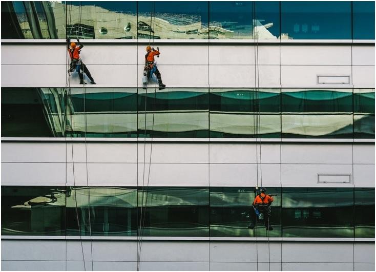 men cleaning window